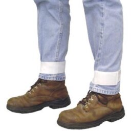 A cropped view of light blue jeans with white cuff bands above brown lace-up work boots on a white background.